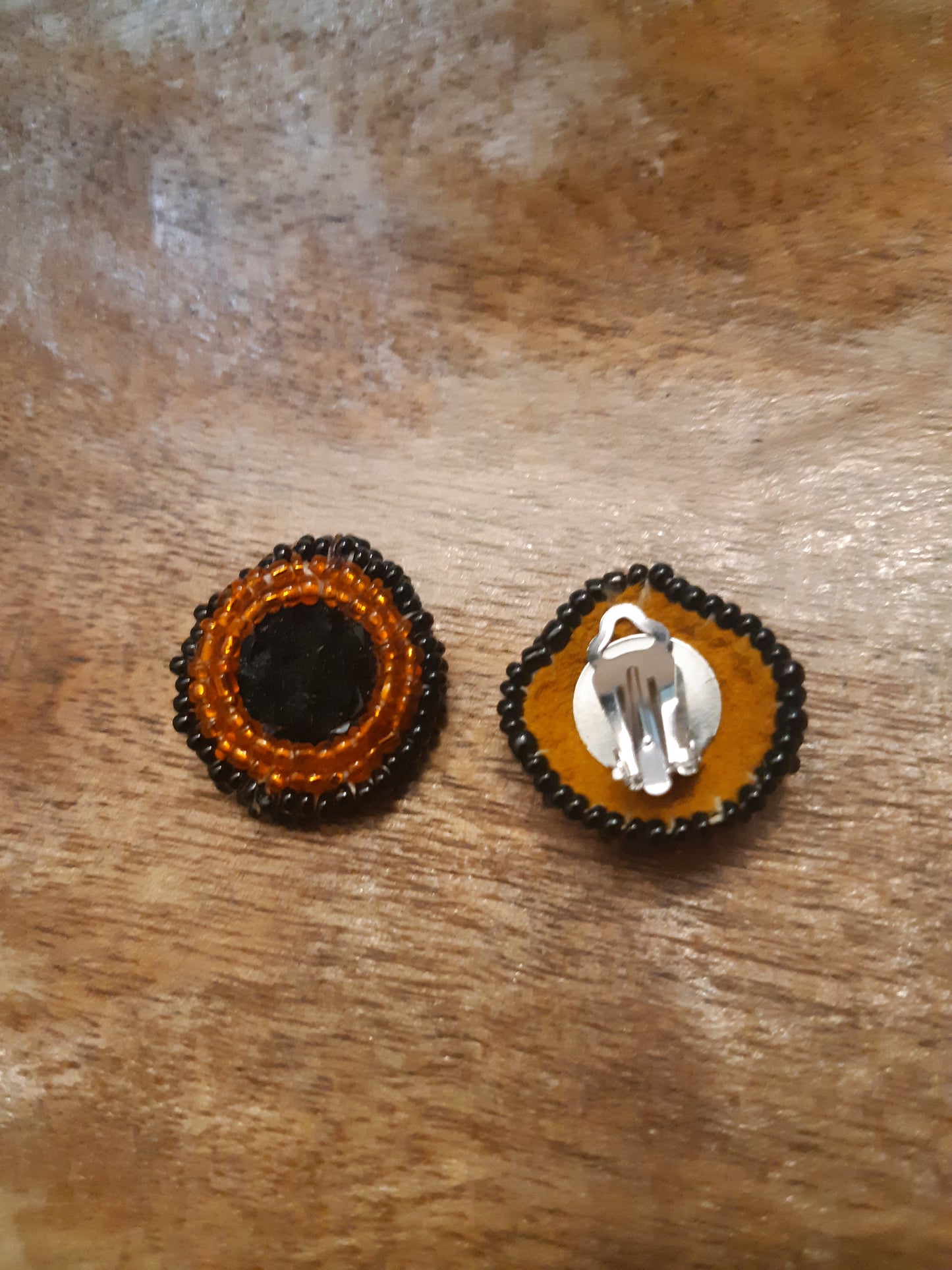 black and orange studs