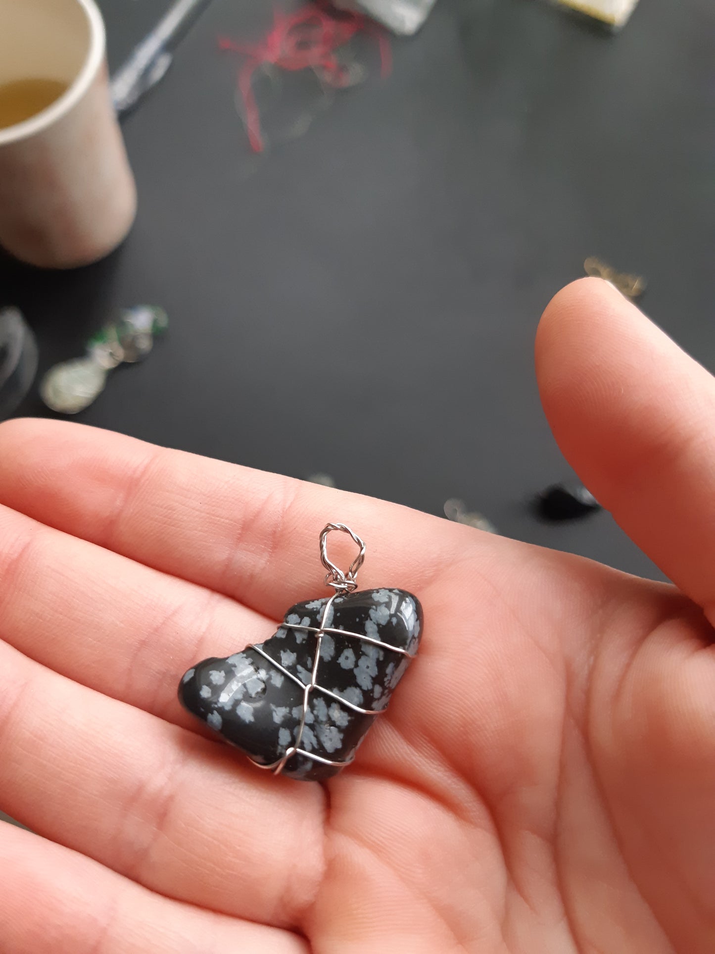snowflake obsidian wire wrapped pendants