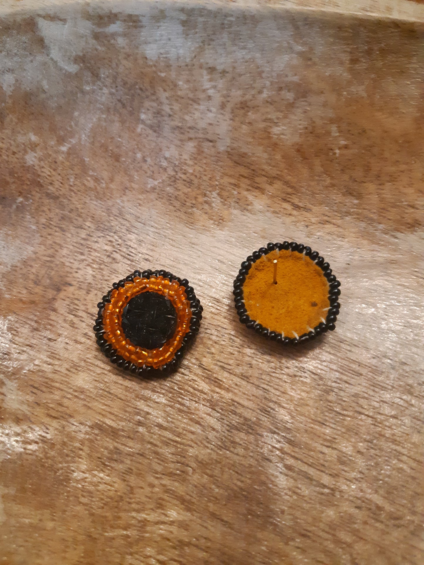 black and orange studs