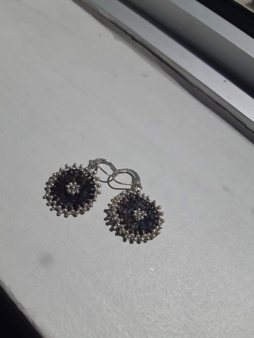 Silver edged flowers on fish skin leather