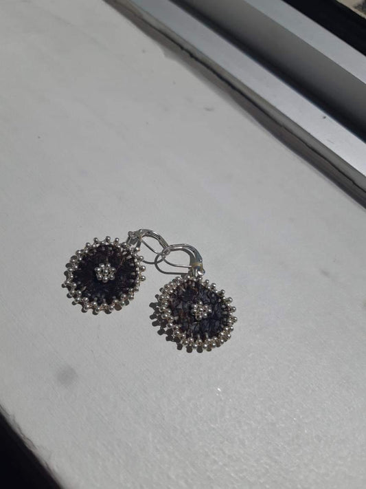 Silver edged flowers on fish skin leather